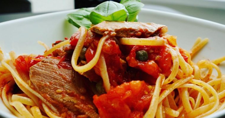 Gluten-free linguine with cherry tomatoes, capers and tuna